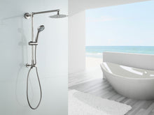 Load image into Gallery viewer, Fennocasa Polaris 1 brushed nickel rain shower head with handheld wand combo in white brightly lit bathroom with a big white bath tub and ocean view.